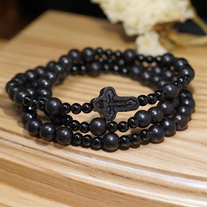 AMUSOUL Crucifix of 6*8 mm Round Black Sandalwood Nylon Cord Rosary