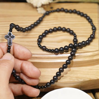 AMUSOUL Crucifix of 6*8 mm Round Black Sandalwood Nylon Cord Rosary
