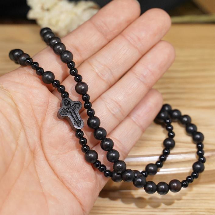 AMUSOUL Crucifix of 6*8 mm Round Black Sandalwood Nylon Cord Rosary