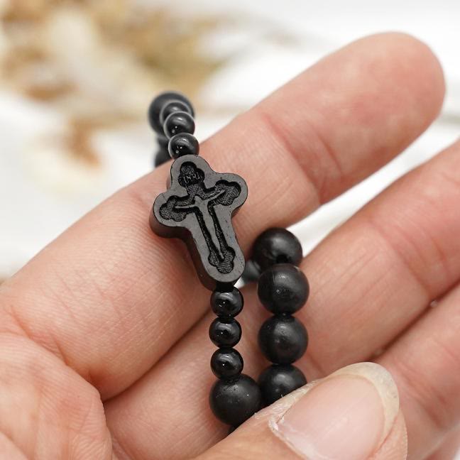 AMUSOUL Crucifix of 6*8 mm Round Black Sandalwood Nylon Cord Rosary