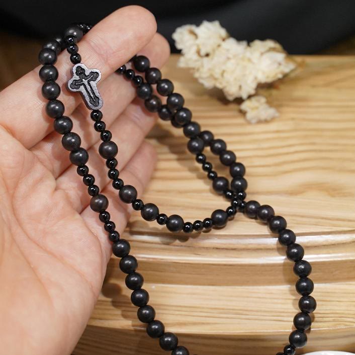 AMUSOUL Crucifix of 6*8 mm Round Black Sandalwood Nylon Cord Rosary