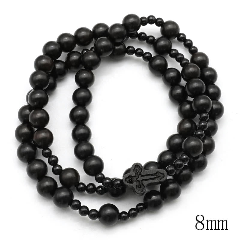 AMUSOUL Crucifix of 6*8 mm Round Black Sandalwood Nylon Cord Rosary