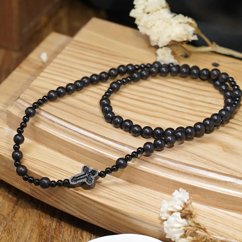 AMUSOUL Crucifix of 6*8 mm Round Black Sandalwood Nylon Cord Rosary