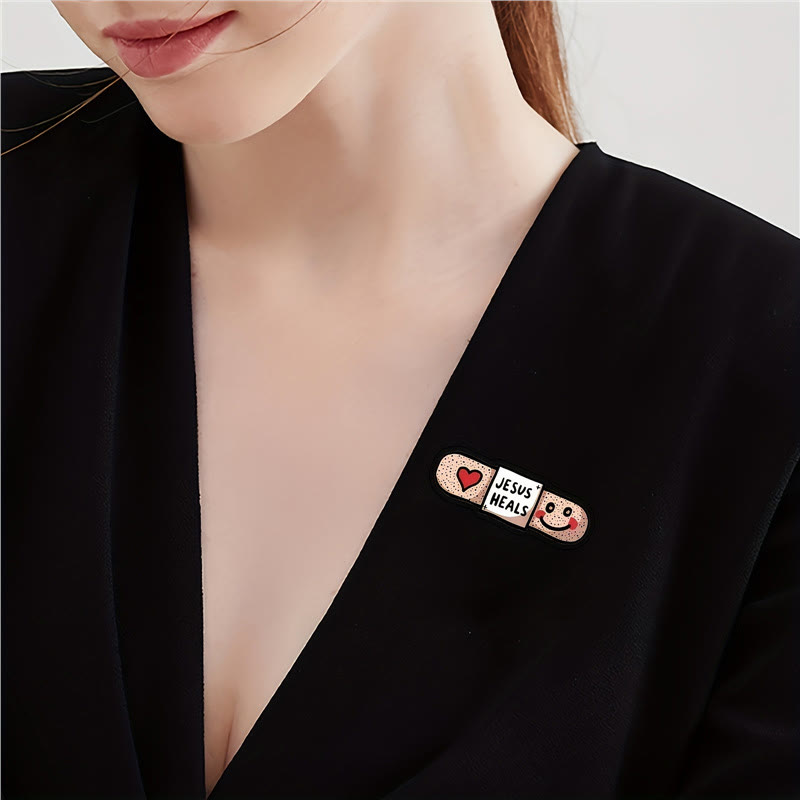 AMUSOUL  Jesus Heals Acrylic Heart Band-Aid Brooch: A Symbol of Faith and Comfort
