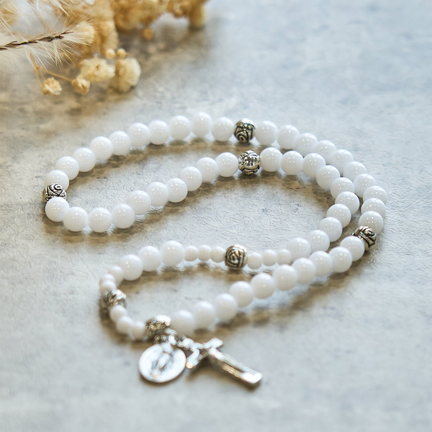 AMUSOUL  6mm White Bead Miraculous Medal & Crucifix Rosary Bracelet: A Symbol of Faith