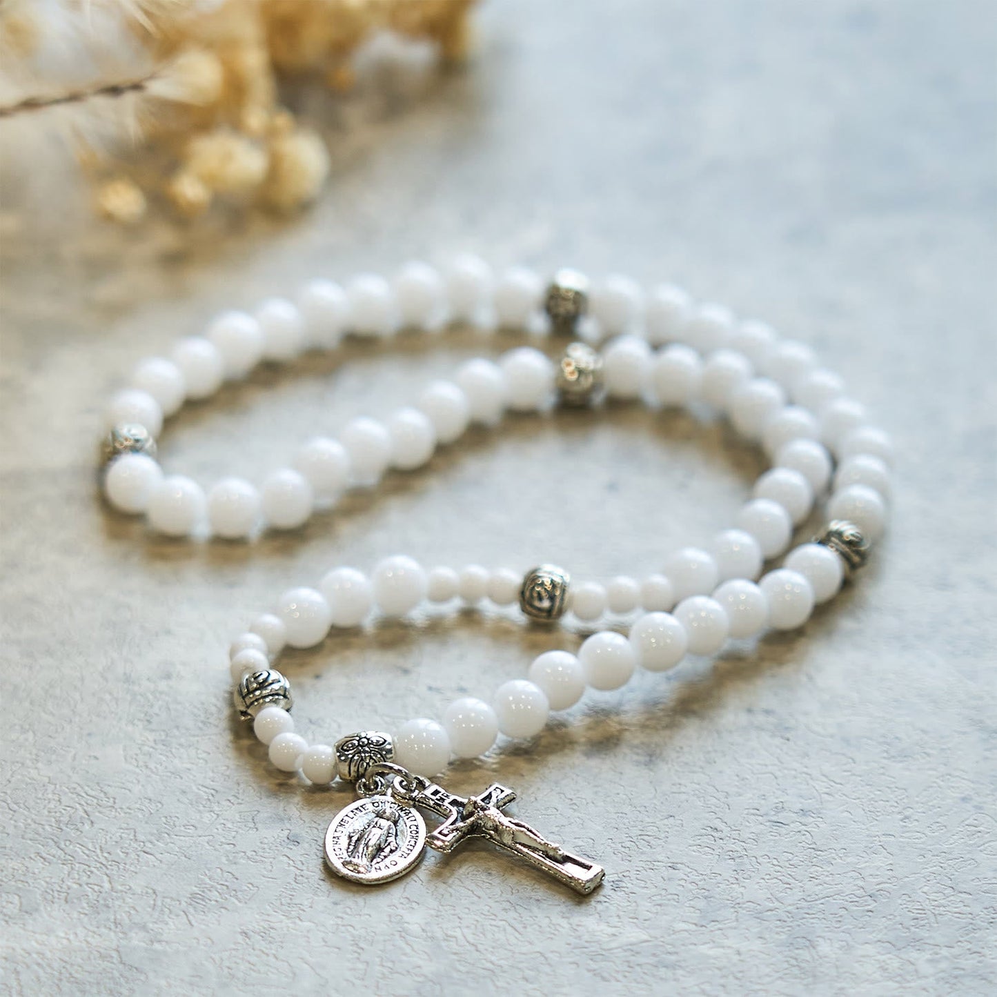 AMUSOUL  6mm White Bead Miraculous Medal & Crucifix Rosary Bracelet: A Symbol of Faith