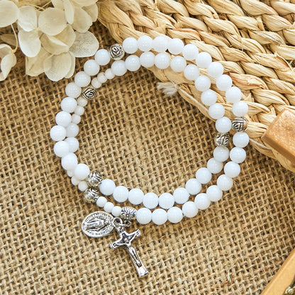 AMUSOUL  6mm White Bead Miraculous Medal & Crucifix Rosary Bracelet: A Symbol of Faith