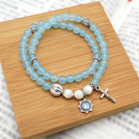 AMUSOUL  6mm Light Blue Bead Miraculous Medal & Crucifix Minimalist Bracelet: A Symbol of Faith