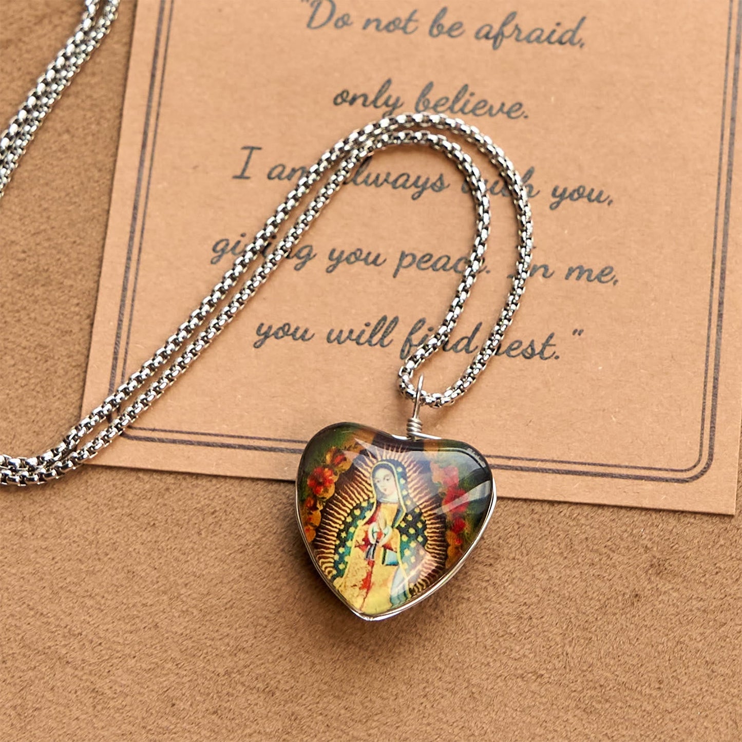 AMUSOUL  Black Our Lady of Guadalupe Glow-in-the-Dark Heart Shaped Resin Medal Necklace